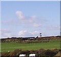 Rhosneigr fire station tower with the sun shining on half of it