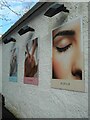 NS5574 : Posters outside the beauty salon by Richard Sutcliffe