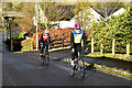 Cyclists powering up a steep hill