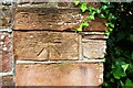 NY2548 : Benchmark on corner of wall on NW side of West Street by Luke Shaw