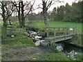 Footpath across a beck on Otley golf course