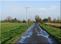 TL5167 : Puddles on Long Drove by John Sutton