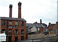 SJ9856 : Three chimneys seen from London Street, Leek by Chris Allen