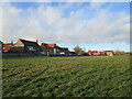 Grass field and housing, Long Bennington