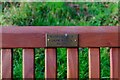 Seat by village pond (2) - plaque, Trimpley, Worcs