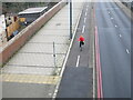 TQ2081 : Lone cyclist by A40, New Year's Day by David Hawgood