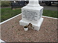 Inscription on the base of the memorial to munitions workers in Erith Cemetery