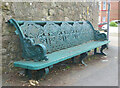 Victorian pier bench on suburban street corner