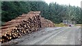 NS8031 : Log stacks on the Nutberry Wind Farm access track by Gordon Brown