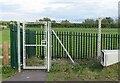 Railway access gate to east side of track from south side of road