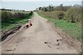 TL4542 : Country Lane Potholes by Glyn Baker