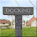 TF7636 : Docking village sign (detail) by Adrian S Pye
