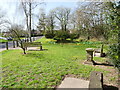 Bluebell Pond North Walsham showing seatsand Sundial with no Hand