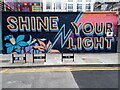 View of "Shine Your Light" street art on Clifton Street