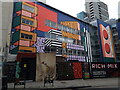 View of Camille Walala street art on the rear of Rich Mix from Redchurch Street