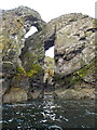 NJ5767 : Natural arches near Redhythe Point by Nigel Feilden