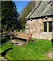 SO4910 : Wooden bench in the  village churchyard, Mitchel Troy, Monmouthshire by Jaggery