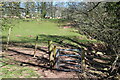 Gate on riverside public footpath