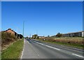 NZ1452 : Looking along the A693 at East Castle by Robert Graham