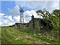 Phone mast and derelict building