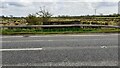 View to fields across A7 where it passes over Well Sike