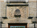 SE1323 : Carved panel over the door of the former co-op. Brookfoot, Brighouse by Humphrey Bolton