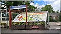 Map, cycle shelter, floral tubs at Parbold station