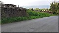 View past corner of walls on SE side of Brown Bank Lane