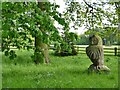 Carved owl adjacent to a footpath