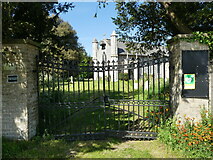 TG2435 : Entrance gates to Church of St Margaret of Antioch by David Pashley