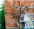 Benchmark on brick wall on east side of Main Street at Yew Tree Farm