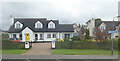 J1527 : Houses in the centre of Mayobridge by Eric Jones