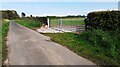 Field gateway with modern gates on SE side of rural road NE of Burnfoot