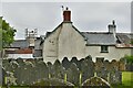 Burrington, Holy Trinity Church: Houses seen from the churchyard