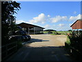 Footpath and farm buildings at Langham Lodge