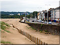 Sand dunes and a city road