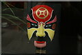 View of a painted mask in the window of The Old Street Chinese Restaurant #5