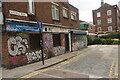 View of street art on the side of Falcon Food Express on Satchwell Road from Bethnal Green Road