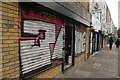 View of shutter art on the front of a shop unit on the corner of Barnet Grove and Bethnal Green Road