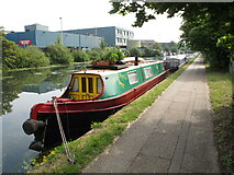 TQ2282 : Narrowboat Dragonfly near Car Giant commercial vehicle site by David Hawgood