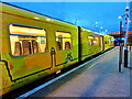 Wirral-themed Merseyrail train at Ellesmere Port station, in the evening