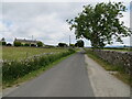 Wall enclosed Wood House Lane approaching Gold Hill