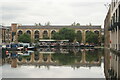 View of a block of flats reflected in the Regent