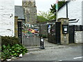 Gate piers and entrance gates to the churchyard