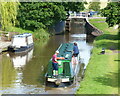 Narrowboat approaching Beeston Iron Lock