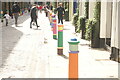 View of brightly painted bollards on Floral Street #4