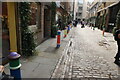 View of brightly painted bollards on Floral Street #6