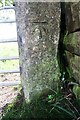 Benchmark on gatepost at gateway on south side of Garland Lane