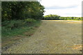 Stubble field by a stream