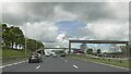 Footbridge and gantry over M6